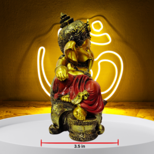 The Global Store - Ganesh ji - Sitting on golden sofa one leg folded on sofa hand on knee in rest position, musak is sitting close to sofa-d