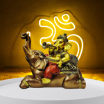 The Global Store - Ganesh ji - sitting on Elephant his vehicle cloth weared painted maroon ganesh ji and vehicle is golden and brown