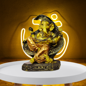 The Global Store - Ganesh ji statue - sitting on big sofa which looks like leaf musak sitting close to feet