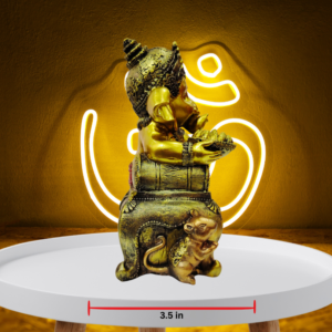 The Global Store - Ganesh ji statue - sitting on sofa and holding one plate of ladoo - depth