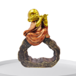 The Global Store - mini buddha sitting on hollow wooden bark playing music