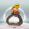 The Global Store - mini buddha sitting on hollow wooden bark playing music