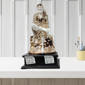 The Global Store - Sai Baba statue - Big rose gold and white with wooden base one leg up on knee - bg