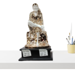 The Global Store - Sai Baba statue - Big rose gold and white with wooden base one leg up on knee - no bg